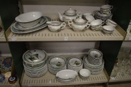 A comprehensive Chinese dinner service painted with landscape scenes.