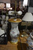 A Chinese famille rose baluster shaped vase converted to a lamp (damaged).
