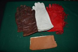 Ladies gloves and a purse.