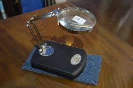 A table magnifier.