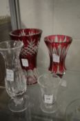 Two William Yeoward cut glass vases and two vases with ruby glass decoration.