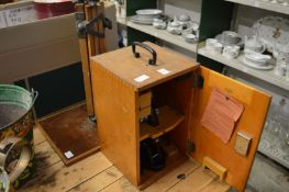 A Carl Zeiss cased microscope together with a stand.