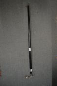 A walking stick with Jaguar mascot handle.