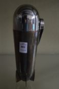 A Zeppelin shaped cocktail shaker with fitted interior.