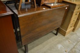 A mahogany drop-leaf dining table.