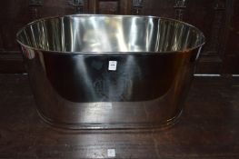 A large metal wine cooler.