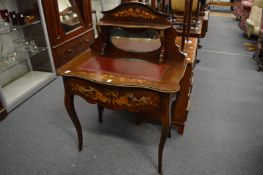 A 19th century marquetry inlaid and ormolu mounted mahogany mirror back writing table.