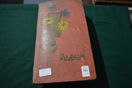 Postcard album and contents.