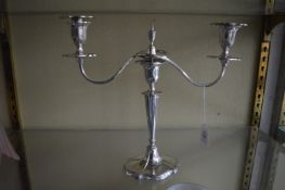 A Walker and Hall plated twin branch candelabra.