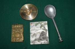 A group of decorative items to include a pewter spoon.