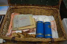Wicker picnic hamper containing miscellaneous items.