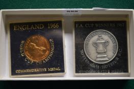 Two cased Commemorative coins for World Cup England 1966 and FA cup winners Tottenham Hotspur 1967.