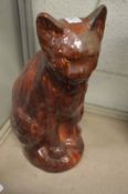 A Ewenny large glazed pottery model of a seated cat.
