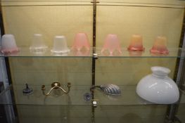 Various pairs and single glass lamp shades and two light fittings.