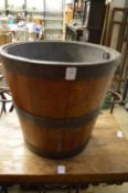 A metal bound hardwood bucket with galvanised liner.