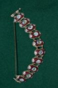 A silver and enamel bracelet.