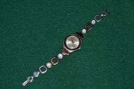 A ladies Swatch wristwatch.