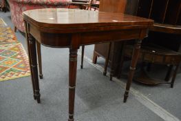 A 19th century mahogany D shaped fold-over card table.