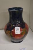 A Moorcroft Pomegranate vase (rim chipped).
