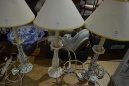 A pair of porcelain seaweed design candlestick style lamp bases together with a matching lamp.