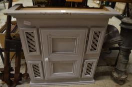 A small grey painted pine cabinet.