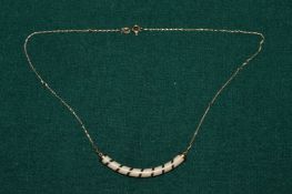An 18ct gold pendant and chain.