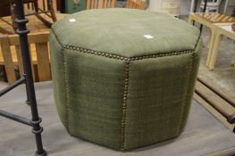 Oka, a green upholstered ottoman foot stool.