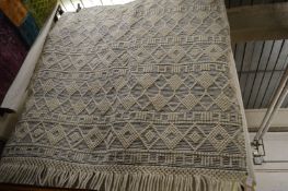 A Moroccan design carpet, 220cm x 160cm.