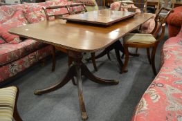 A 19th century mahogany twin pillar extending dining table with three leaves.