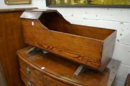 An 18/19th century pine cradle.