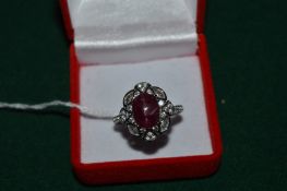 A silver ring set with a 4.5ct natural ruby with certificate.