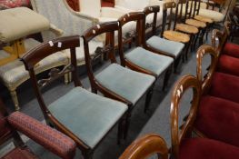 A set of four George IV rosewood dining chairs with drop-in seats.