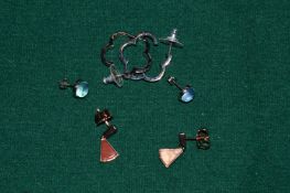 Three pairs of silver earrings.