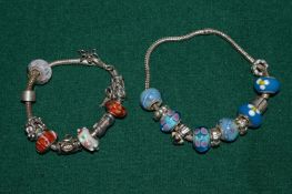 Two silver and porcelain bracelets.