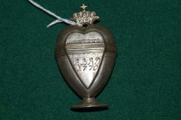 An 18th century white metal heart shaped vinaigrette engraved R B R D 1770.