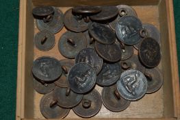 A collection of coin mounted buttons.