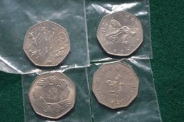 A bag of four fifty pence pieces.
