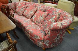 Wesley-Barrell, a large settee with curving back and arms, upholstered in a pink ground paisley