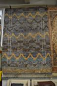 A Moroccan design woolen carpet, 388cm x 180cm.