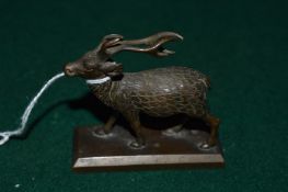 A small cast brass model of a deer.