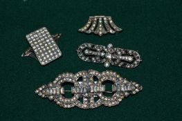 Two diamante brooches and a similar buckle.
