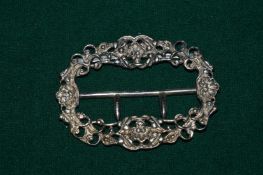 A silver belt buckle.