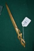 An Art Nouveau style brass letter opener.