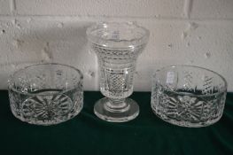 A pair of cut glass bowls and a cut glass pedestal vase.