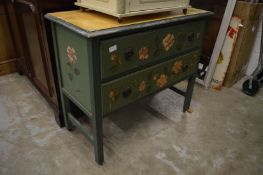 A decoratively painted two drawer chest.