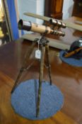 A table telescope with tripod base.