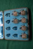 Part cased set containing six embossed silver and glass whiskey or liqueur cups.