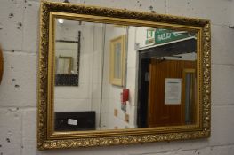 A gilt framed rectangular mirror.