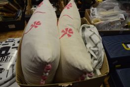 A pair of Designers Guild cushions and a cover.