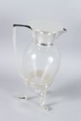 A SILVER PLATED GLASS DECO CLARET JUG.